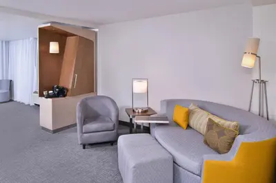 a living room with a couch and a chair at Courtyard by Marriott Columbus Grove City in Grove City