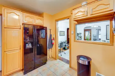 a bathroom with a shower and a glass door at 1 Mi to Akron Zoo Ranch-Style Home with Yard! in Akron