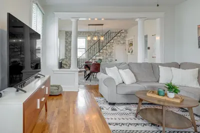 a living room with a couch and a table at Pet-Friendly Oakley Gem with Large Backyard! in Cincinnati