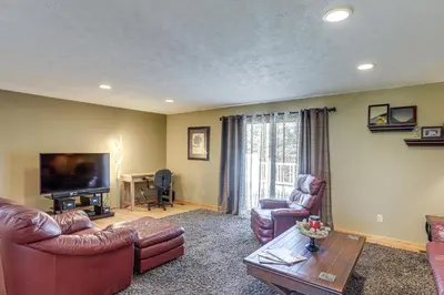 a living room with leather furniture and a flat screen tv at Work and Relax! Spacious Ontario Home with Pool