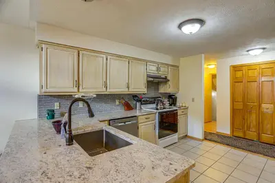 a kitchen with a sink and a counter top at Work and Relax! Spacious Ontario Home with Pool