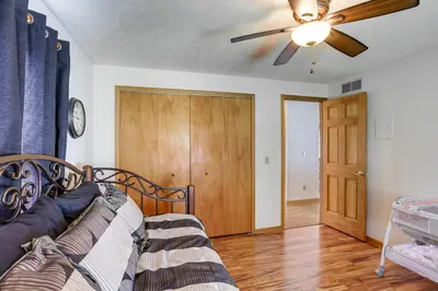 a living room with a couch and a ceiling fan at Work and Relax! Spacious Ontario Home with Pool