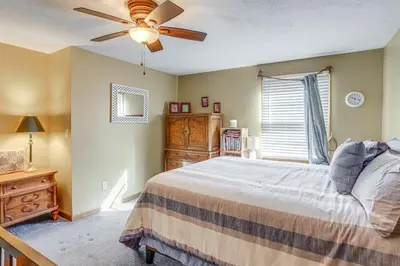 a bedroom with a bed and a ceiling fan at Work and Relax! Spacious Ontario Home with Pool