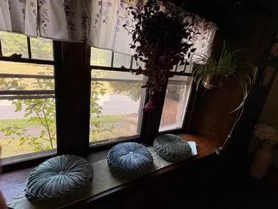 three blue bean bags sitting in front of a window at Tree House 6 bedrooms, 2 blocks from everything in Cuyahoga Falls