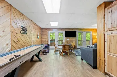 a large room with a ping pong table in it at Hot Tub & WiFi - Birdsong - Red River Gorge KY in Stanton