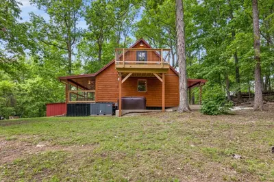 a cabin in the woods with a tree at Hot Tub - Furnace Mountain Retreat - #RRG in Stanton