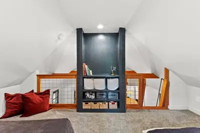 a room with a black cabinet in the attic at Hot Tub - Furnace Mountain Retreat - #RRG in Stanton