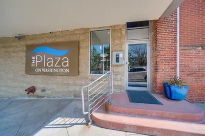 a building with a sign that reads pizza on a building at 3 Mi to Dtwn Cleveland Condo with Lake Erie Views! in Cleveland