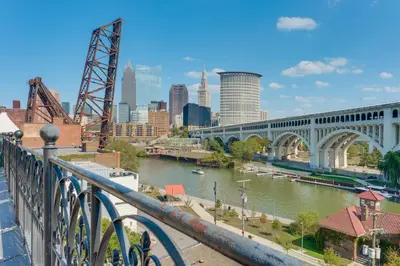 a view of a river with a bridge and a city at 3 Mi to Dtwn Cleveland Condo with Lake Erie Views! in Cleveland