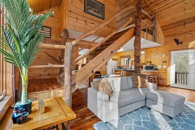 a living room with a couch and a table at Hot Tub No Pet Fee Prime Location - Beary Cozy in Slade