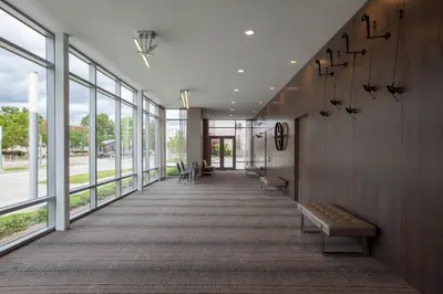 a hallway with benches and windows in a building at Holiday Inn Cleveland Clinic by IHG in Cleveland