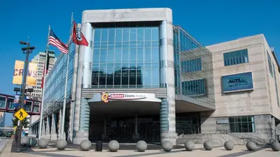 a building with two american flags in front of it at Holiday Inn Cleveland Clinic by IHG in Cleveland