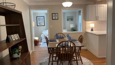 a kitchen and dining room with a table and chairs at Newly renovated 3-bedroom lakeside home in Euclid