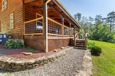 a wooden house with a porch and a stairway to it at Pool Table WiFi Starry Mountain Night RRG in Stanton
