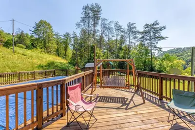 a deck with two chairs and a swing at Pool Table WiFi Starry Mountain Night RRG in Stanton