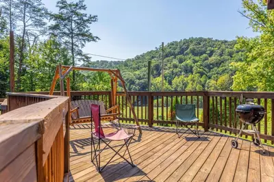 a deck with chairs and a swing and a grill at Pool Table WiFi Starry Mountain Night RRG in Stanton