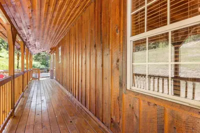 an empty porch of a wooden house with a window at Pool Table WiFi Starry Mountain Night RRG in Stanton