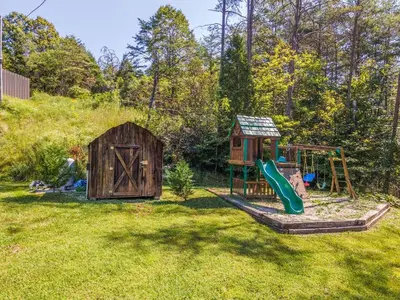 a backyard with a play set and a playground at Pool Table WiFi Starry Mountain Night RRG in Stanton