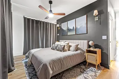 a bedroom with a bed and a ceiling fan at Primrose - Cave Run Lake OR Red River Gorge KY in Wellington
