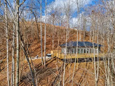 a wooden gazebo in the middle of a forest at Primrose - Cave Run Lake OR Red River Gorge KY in Wellington
