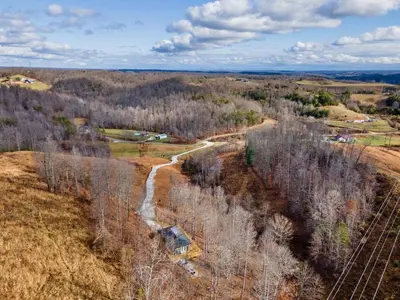 an aerial view of a train track in a field at Primrose - Cave Run Lake OR Red River Gorge KY in Wellington