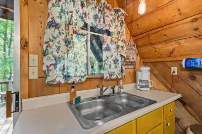 a kitchen with a sink and a window at Sugar Shack - Cave Run Lake OR Red River Gorge KY in Bangor