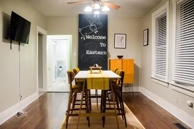 a dining room with a table and chairs at Classic Hilltop 3br home on Eastern ready for you! in Cincinnati