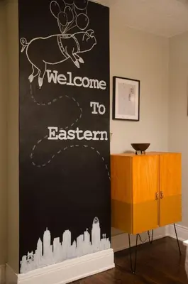 a chalkboard with a welcome to eastern sign in a room at Classic Hilltop 3br home on Eastern ready for you! in Cincinnati
