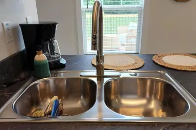 a stainless steel kitchen sink with a faucet at WiFi Firepit Fishing Pond - FarmView in Hazel Green