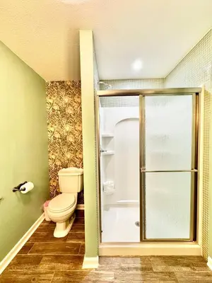 a bathroom with a toilet and a shower at The Porch in Marion
