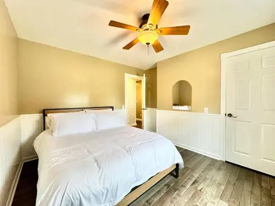 a bedroom with a bed with a ceiling fan at The Porch in Marion