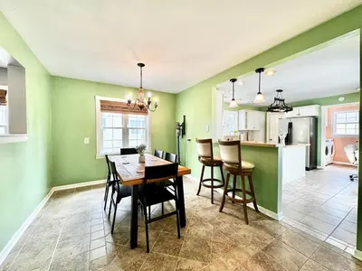 a kitchen and dining room with a table and chairs at The Porch in Marion