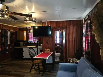 a living room with a couch and a table at The Huntsmen in Hillsboro