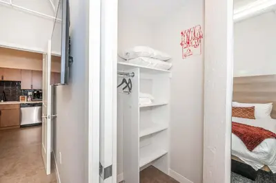a room with a closet with white shelves at The 333 Suites 202 - Stay for 6 in Cincinnati