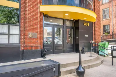 a store front of a building with a large door at The 333 Suites 202 - Stay for 6 in Cincinnati