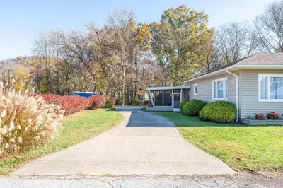 a house with a sidewalk in front of a yard at The Corner House in Ripley