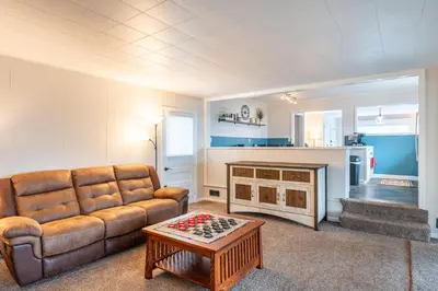 a living room with a couch and a table at The Corner House in Ripley