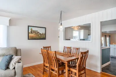 a kitchen and dining room with a table and chairs at The Corner House in Ripley