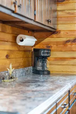 a kitchen with a coffeemaker on a counter at Wildlife Cabin