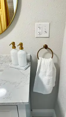 a bathroom with two rolls of toilet paper on a sink at Modern House near OSU and Short North in Columbus