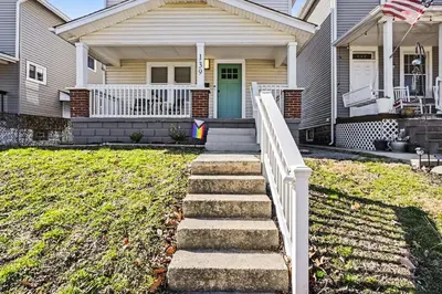 a house with a staircase leading to the front door at 2 Bedroom Home - Posh Princeton Pad in Columbus