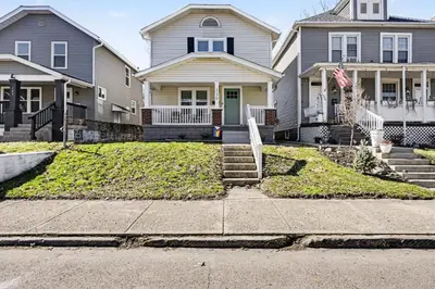 a row of houses on the side of a street at 2 Bedroom Home - Posh Princeton Pad in Columbus