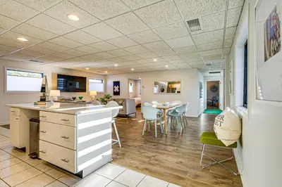 a kitchen and living room with a table and chairs at Between Restaurant and Brewery! Chic Perrysburg Apt in Perrysburg