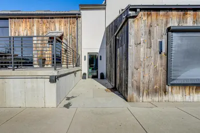 an external view of a building with a wooden wall at Between Restaurant and Brewery! Chic Perrysburg Apt in Perrysburg