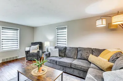 a living room with a couch and a chair at Cozy Home 4 Mi to YSU Campus Penguins Welcome! in Youngstown