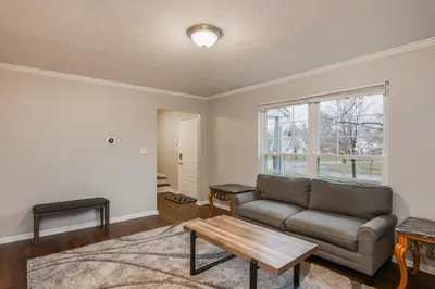 a living room with a couch and a table at Spacious 4BR Near Botanical Gardens in Columbus