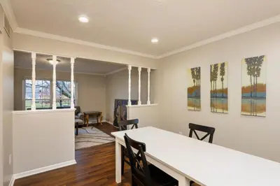 a dining room with a white table and chairs at Spacious 4BR Near Botanical Gardens in Columbus