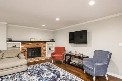 a living room with a couch and two chairs at Spacious 4BR Near Botanical Gardens in Columbus