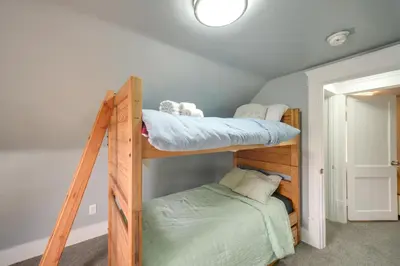 a bedroom with two bunk beds in a room at Modern and Convenient! Group Stay in Highland Square in Akron