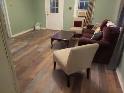 a living room with a couch and chairs and a table at Marina house